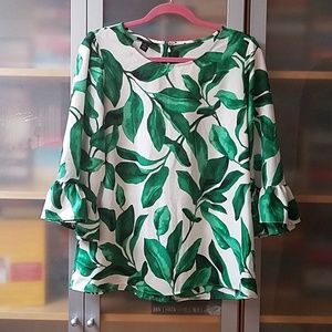 Green and white print blouse